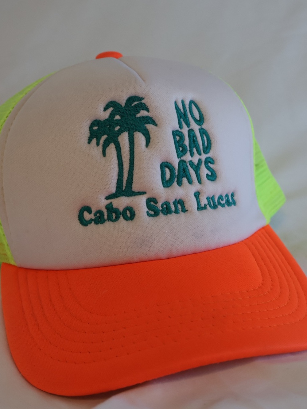 Neon Cabo Tourist trucker hat